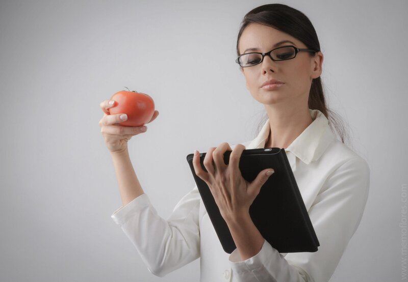 woman holding apple and tablet