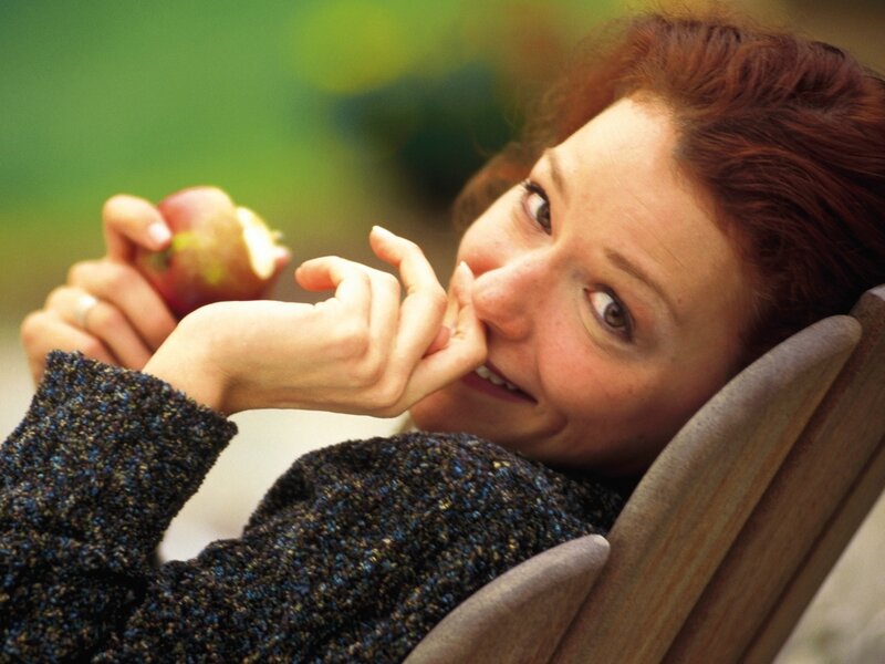 Woman Holding Apple — Brown, Relaxed