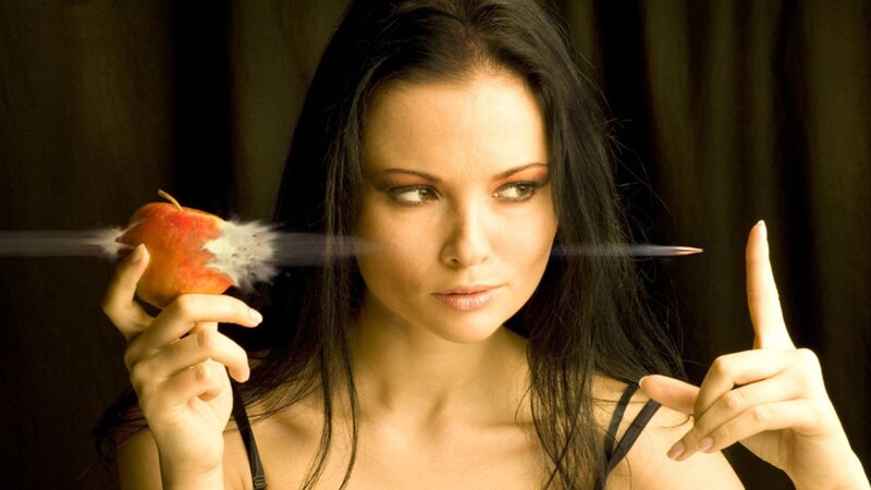 woman holding apple with arrow
