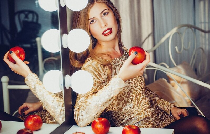 Woman Holding Apples — Gold