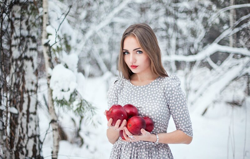 Woman Holding Apples — White, Serene, Winter