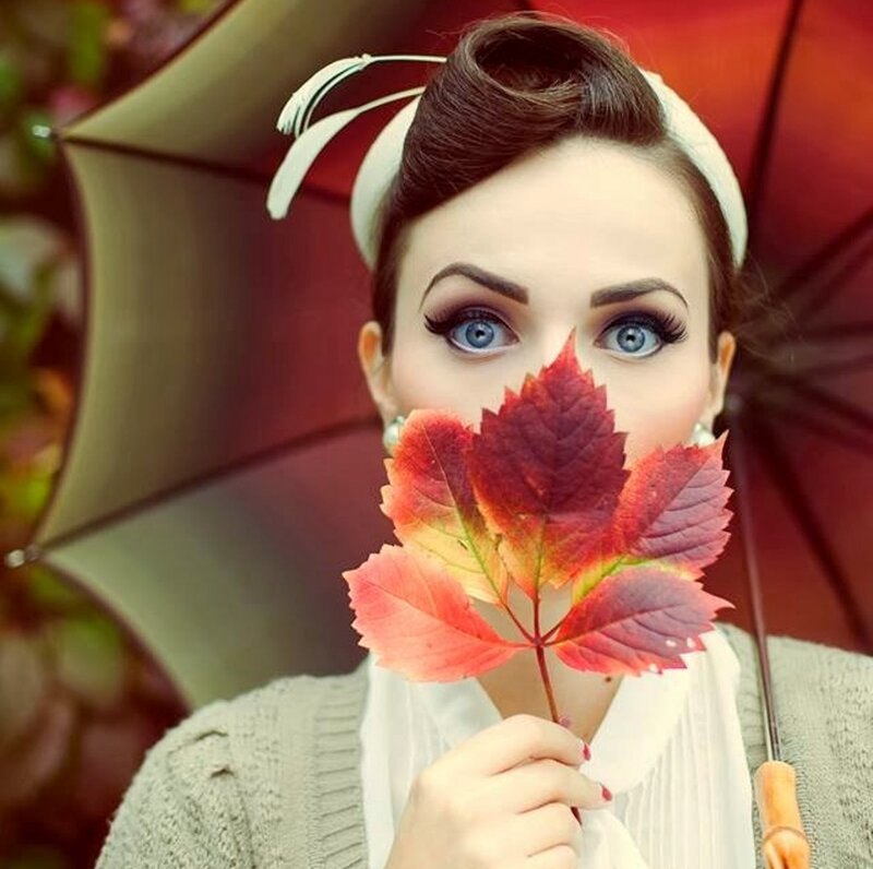 Woman Holding Autumn Leaf — Red
