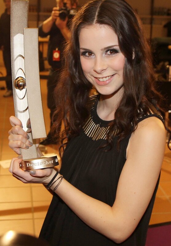 woman holding award