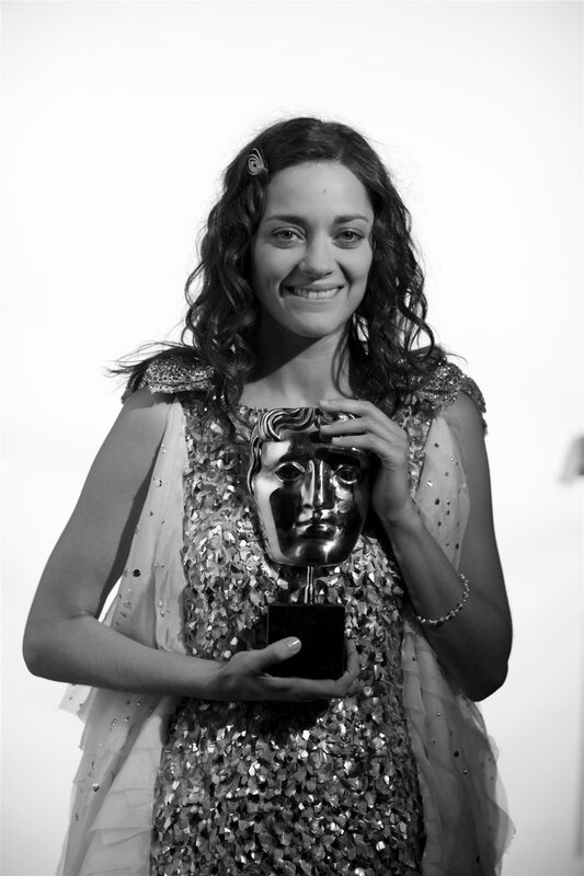 woman holding award