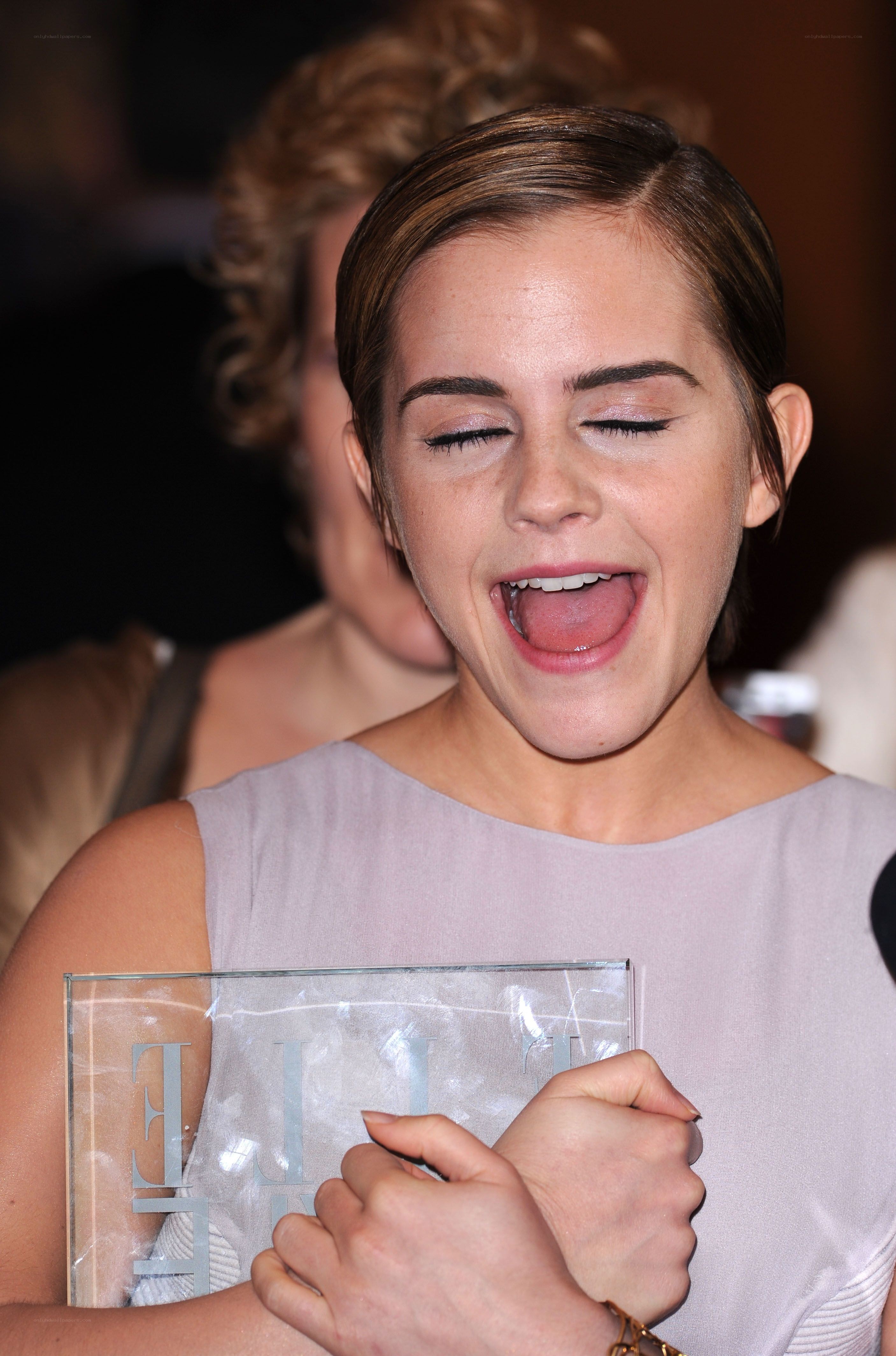woman holding award