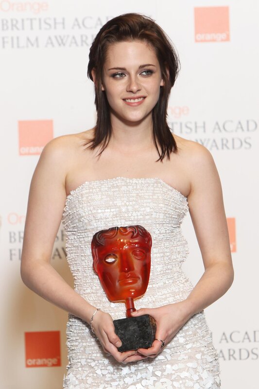 woman holding award