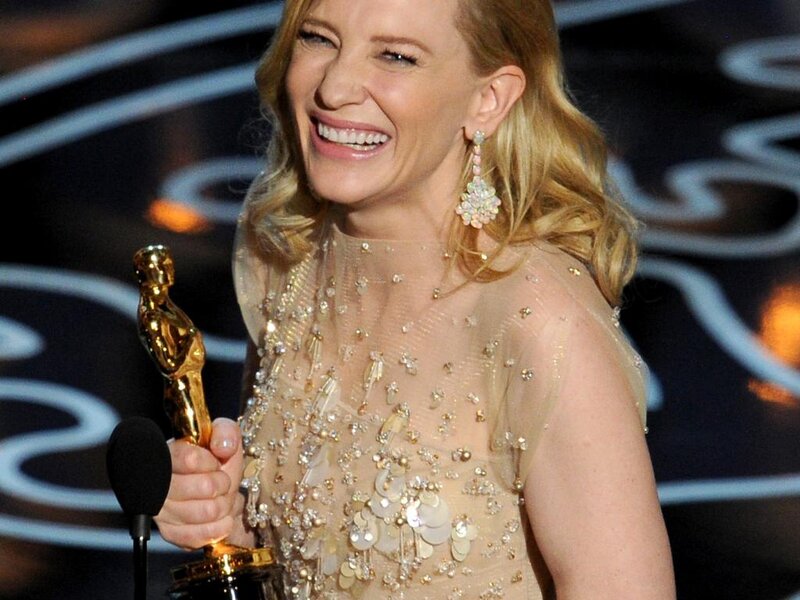 Woman Holding Award — Gold