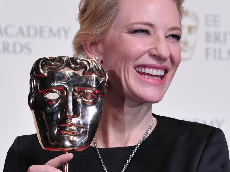 Woman Holding Award — Silver