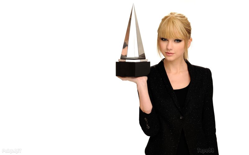 woman holding award trophy