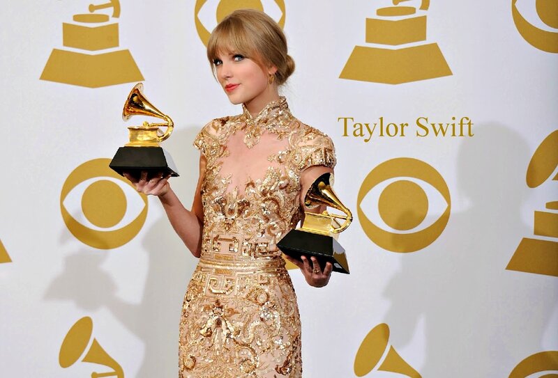 Woman Holding Awards — Gold