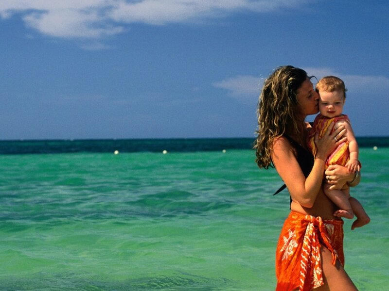Woman Holding Baby — Blue, Serene, Afternoon, Photograph