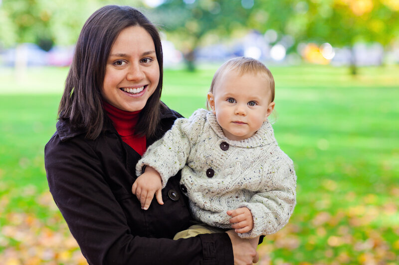 Woman Holding Baby — Green, Serene, Autumn