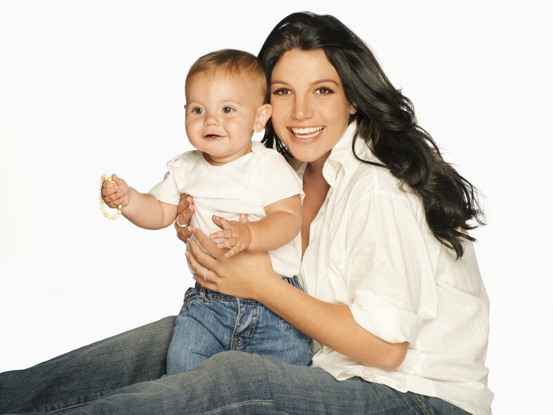 woman holding baby on lap