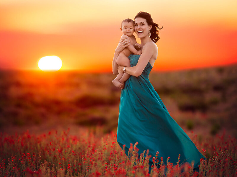 Woman Holding Baby — Orange