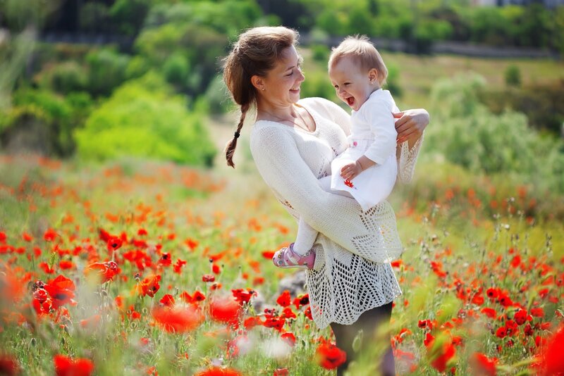 Woman Holding Baby — Red, Joyful