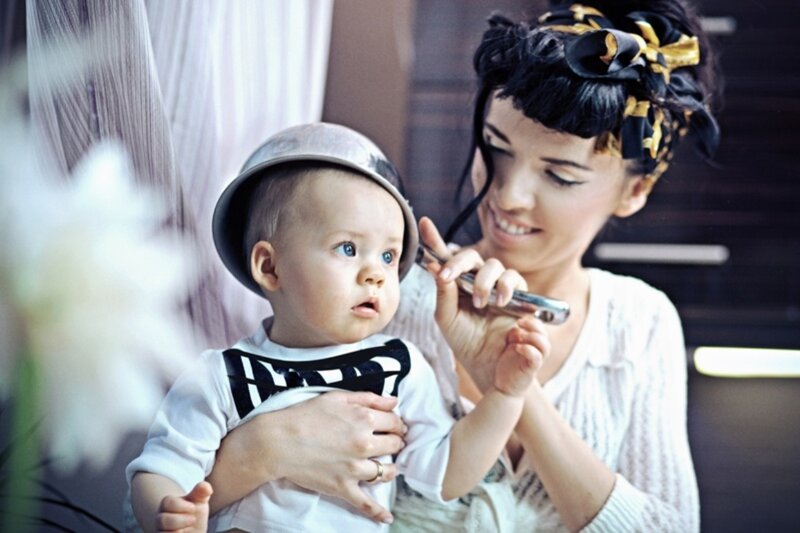 Woman Holding Baby — White, Calm, Photograph, Hat