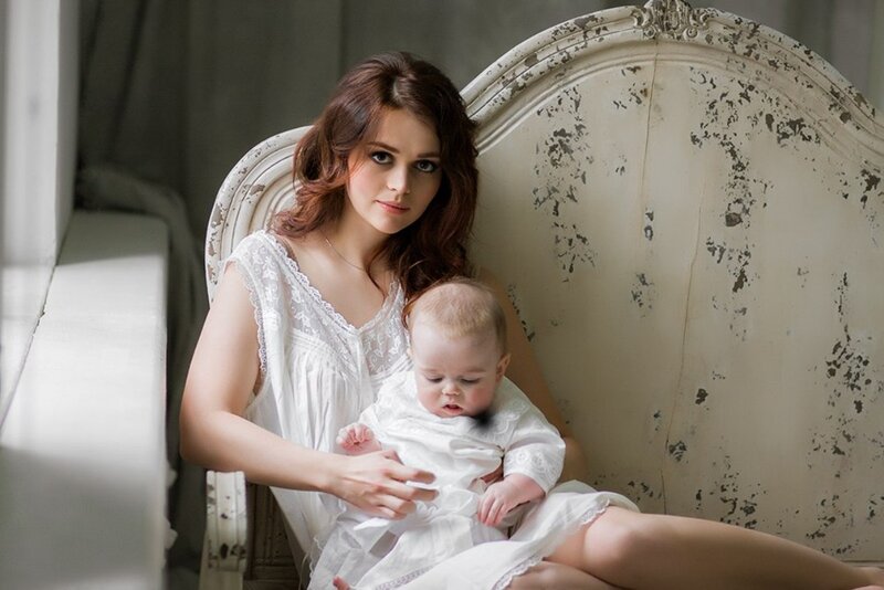 Woman Holding Baby — White, Serene, Afternoon, Photograph, Chair, Window