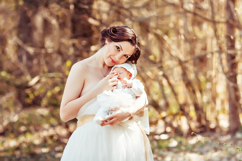 Woman Holding Baby — White, Serene, Spring