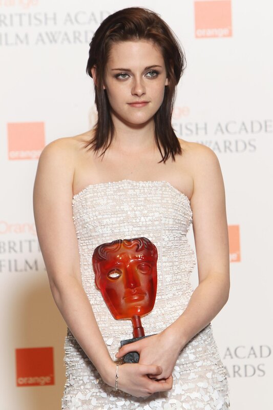 woman holding bafta award