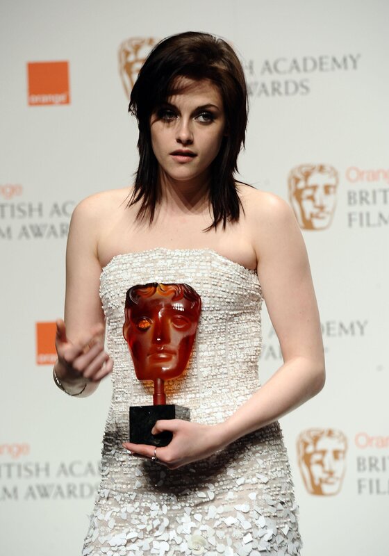 woman holding bafta award