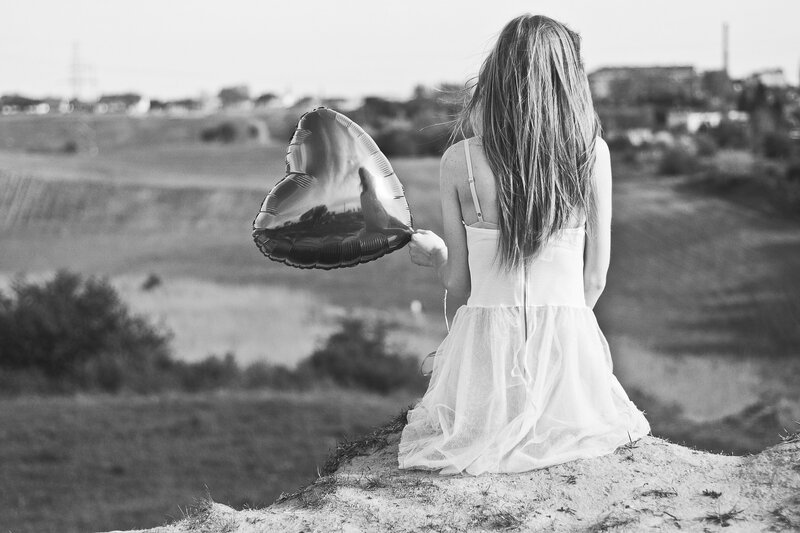 Woman Holding Balloon — Black
