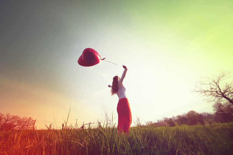 Woman Holding Balloon — Red