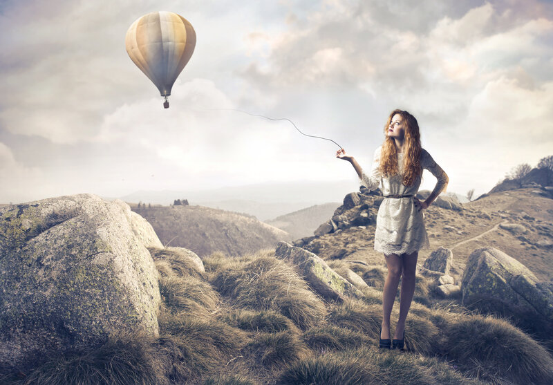 Woman Holding Balloon String