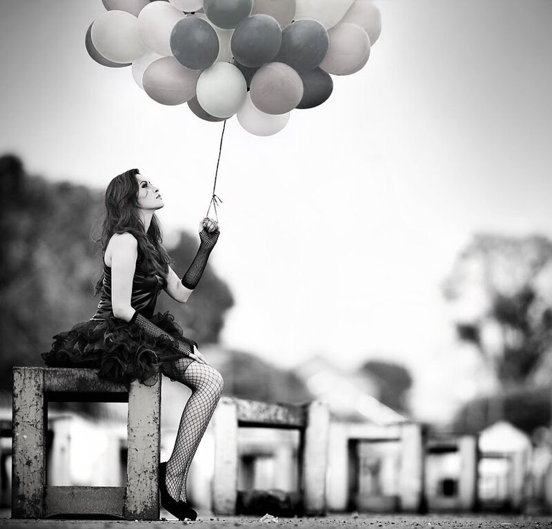 Woman Holding Balloons — Black, Dramatic, Photograph, Bench
