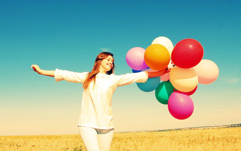 Woman Holding Balloons — Blue, Joyful