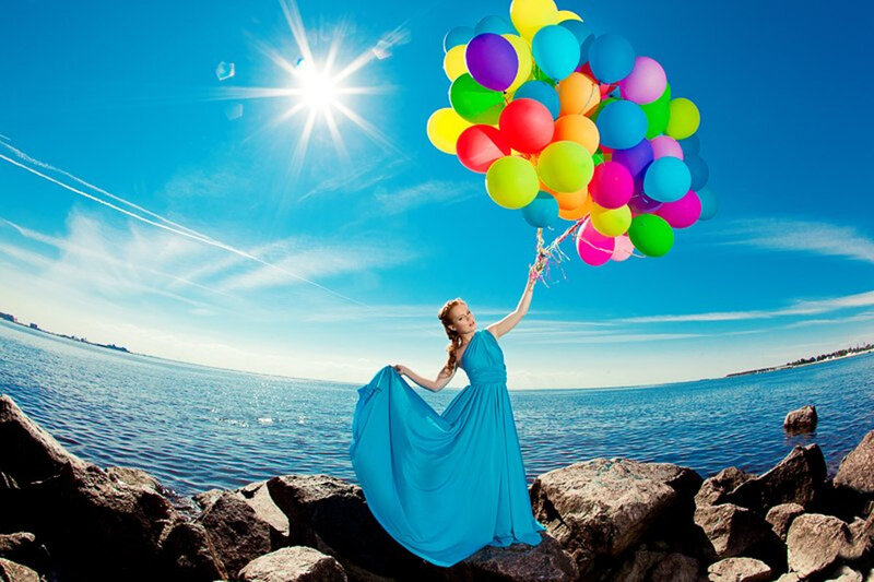 Woman Holding Balloons — Blue, Serene, Afternoon, Photograph