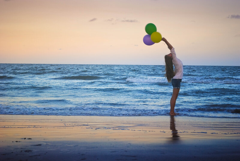 Woman Holding Balloons — Blue, Serene, Sunset
