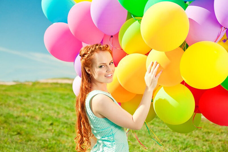 Woman Holding Balloons — Green