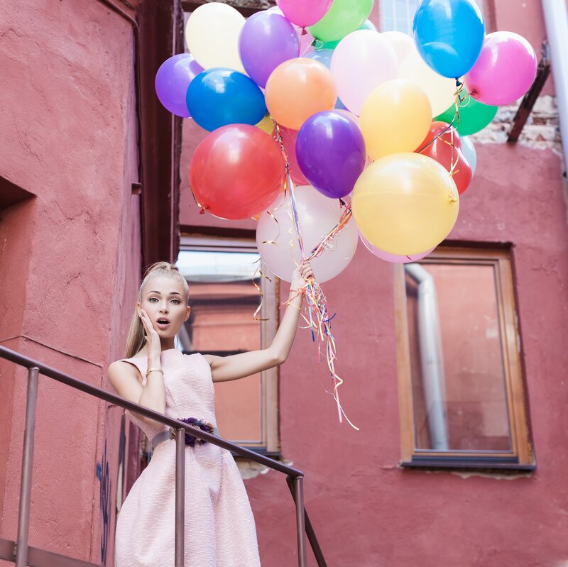Woman Holding Balloons — Pink, Festive