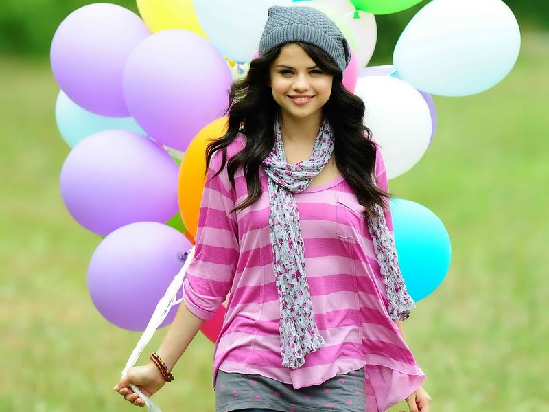Woman Holding Balloons — Pink