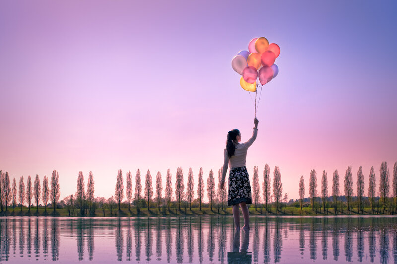 Woman Holding Balloons — Purple, Serene