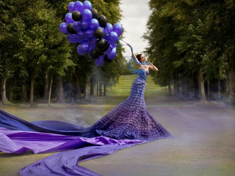 Woman Holding Balloons — Purple
