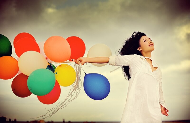 Woman Holding Balloons — White
