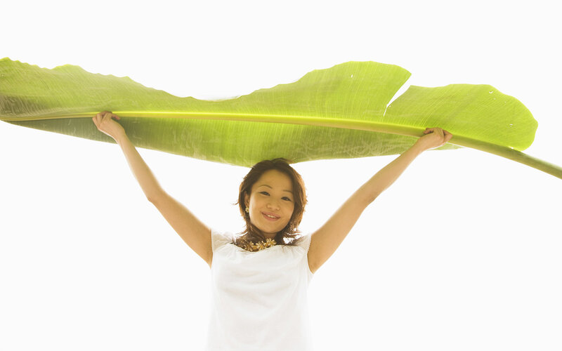 Woman Holding Banana Leaf