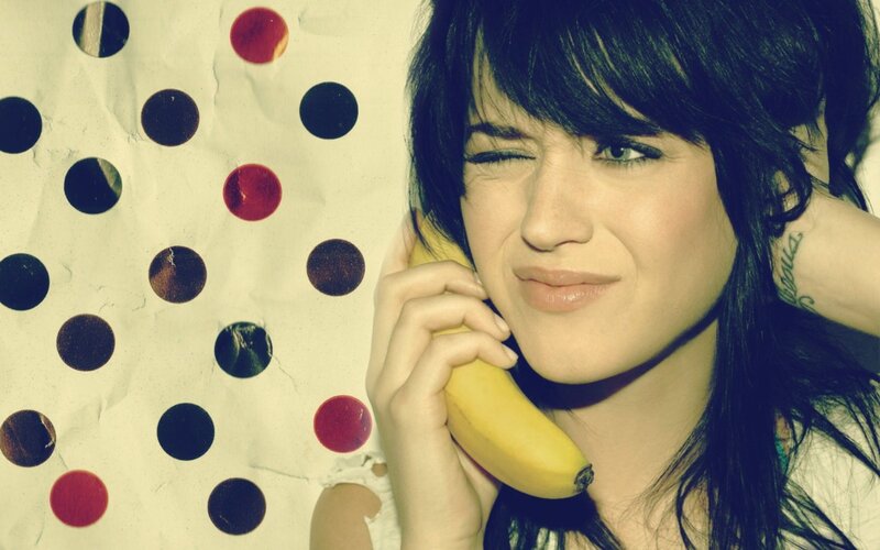 woman holding banana phone