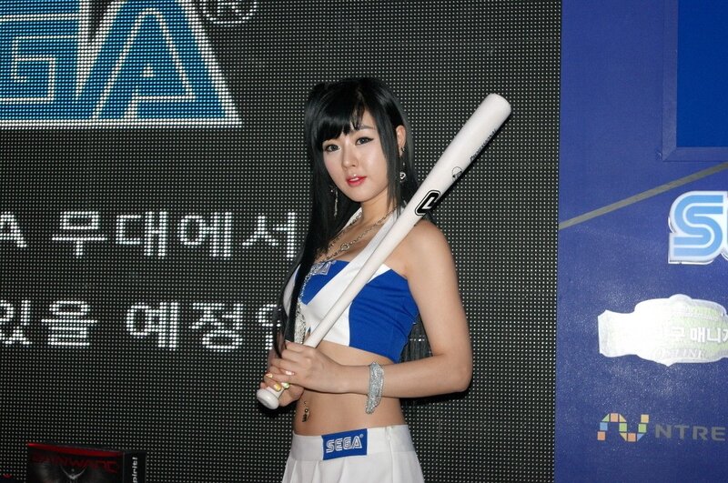 woman holding baseball bat at event