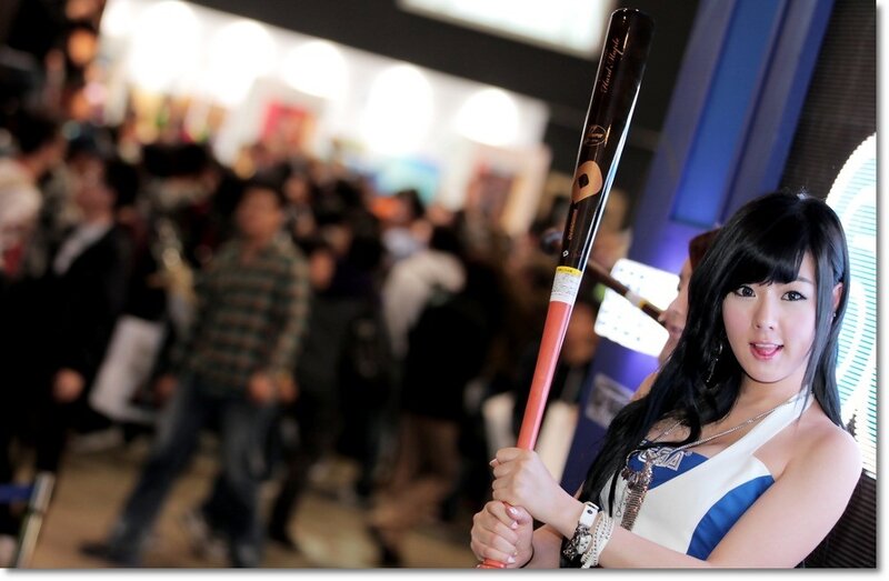 Woman holding baseball bat at event
