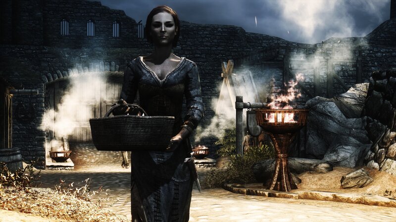 woman holding basket in medieval town