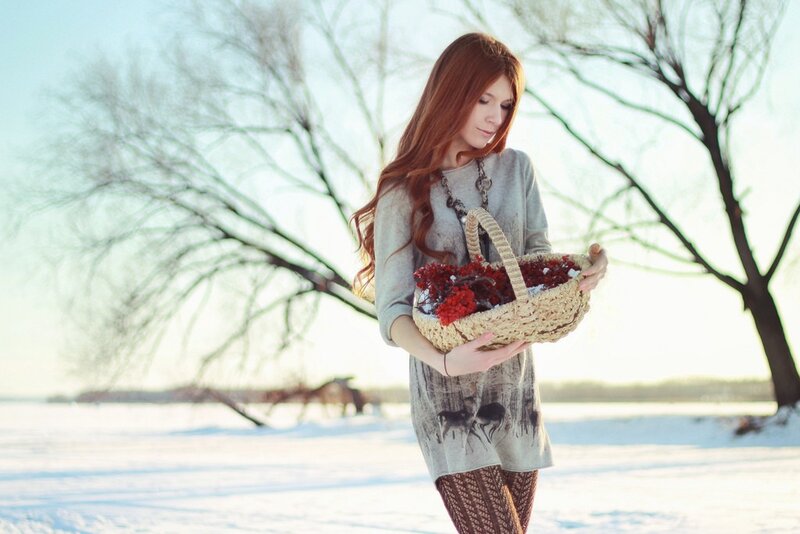 Woman holding basket in winter