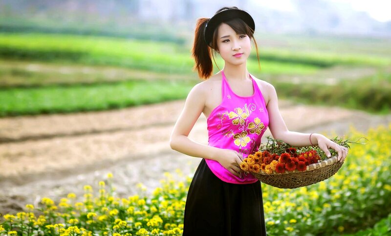 Woman Holding Basket of Flowers — Pink