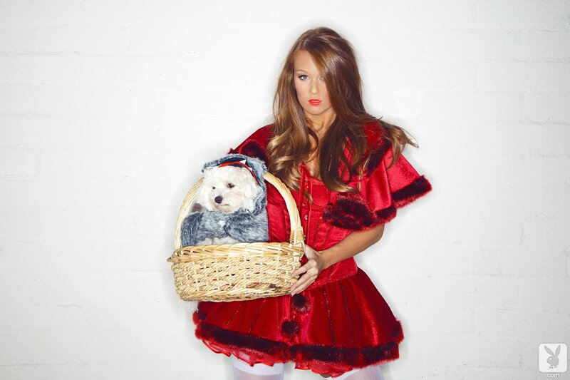 woman holding basket with dog