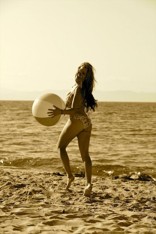 Woman Holding Beach Ball — Brown, Relaxed