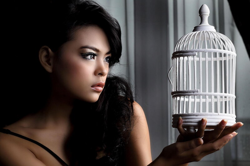 Woman Holding Birdcage — Black, Dramatic, Photograph, Makeup