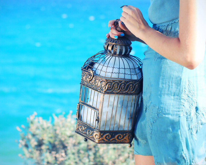 Woman Holding Birdcage — Blue