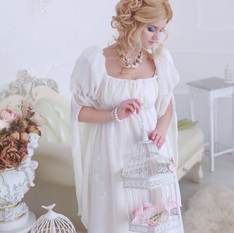 Woman Holding Birdcage — White, Serene, Photograph, Flowers