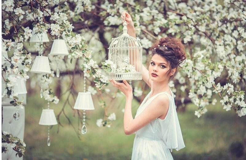 Woman Holding Birdcage — White, Serene, Spring, Photograph, Flowering Tree